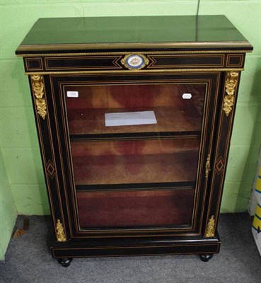 Lot 1298 - Empire style inlaid parcel gilt display cabinet, inset with a painted porcelain panel