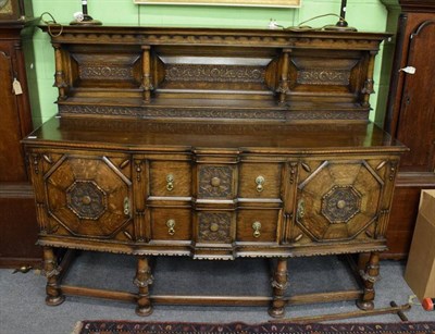 Lot 1302 - Late Victorian carved oak bow front sideboard