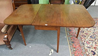 Lot 1312 - A 19th century mahogany drop leaf dining table