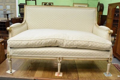 Lot 1314 - A French style two seater cream and gilt painted sofa with feather cushions, 135cm wide