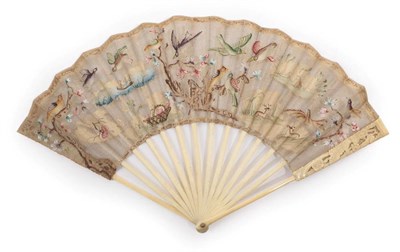 Lot 2024 - A Very Unusual Mid-18th Century Ivory Fan, the monture relatively plain except for carving to...