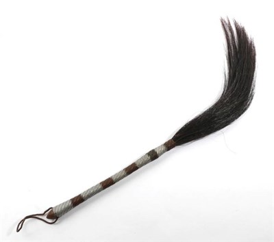 Lot 2055 - A 19th Century Fly Whisk, dark animal hair mounted on a wooden handle, bound in silver and...