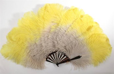 Lot 2062 - A Large and Extravagant 1920's Ostrich Feather Fan, unused, the tortoiseshell sticks still...