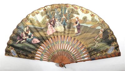 Lot 2099 - A Wooden Fan, with carved and painted sticks, of a mid-1800's style, but colours suggesting...