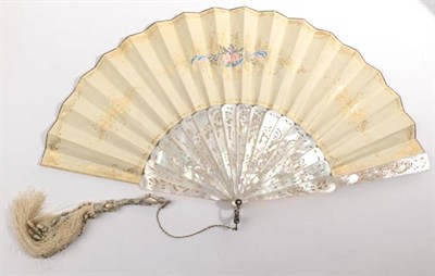 Lot 2101 - A Circa 1850's White Mother-of-Pearl Fan, the monture elaborately carved and pierced, with a figure