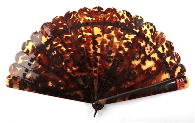 Lot 2112 - A Late 19th Century Tortoiseshell Brisé Fan, plain save for the initials AM in coral, mounted...