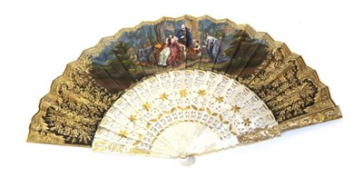 Lot 2135 - A Circa 1850's Mother-of-Pearl Fan, the monture carved and heavily gilded in the Spanish style, the