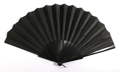 Lot 2144 - A Large Circa 1890's Black Wooden Fan, mounted with a black silk satin leaf finely painted with...