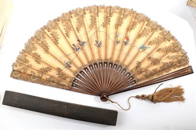 Lot 2146 - A Circa 1890's Fan, with wooden sticks engraved and gilded, the leaf of pale ginger gauze...