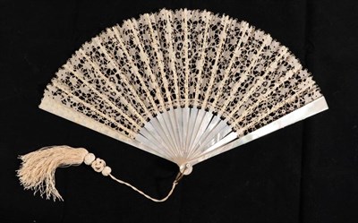 Lot 2150 - A Late 19th or Early 20th Century White Mother-of-Pearl Fan, mounted with a leaf of...