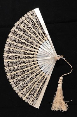 Lot 2150 - A Late 19th or Early 20th Century White Mother-of-Pearl Fan, mounted with a leaf of...
