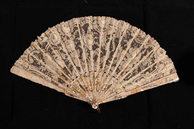 Lot 2153 - A Late 19th Century Brussels Point de Gaze Lace Fan, the lace mounted on pink mother-of-pearl...