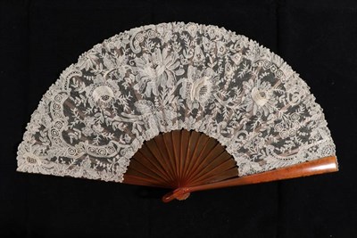 Lot 2154 - A Late 19th Century Fan, with plain blond tortoiseshell sticks, mounted with a leaf of Brussels...