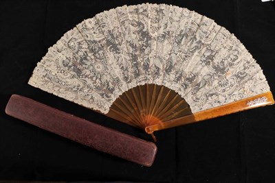 Lot 2157 - A Large Circa 1890's Fan, the blonde tortoiseshell monture plain save for a diamond emblem fixed to