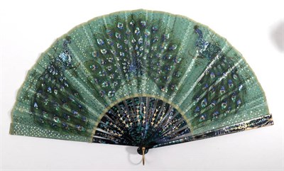 Lot 2170 - Fanned Feathers: A Rather Dramatic Mother-of-Pearl Fan, late 19th/early 20th century, the monture a