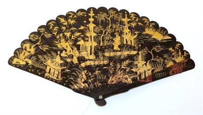 Lot 2180 - A Chinese Wooden Fan, circa 1840's, lacquered in black and different shades of gold, with...