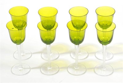 Lot 535 - A Set of Eight Lalique Treves Pattern Hock Glasses, each with olive green bowl, raised on a...