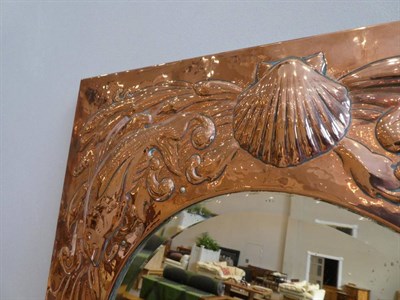 Lot 537 - An Arts & Crafts Newlyn Copper Rectangular Wall Mirror, repoussé decorated with fish and...