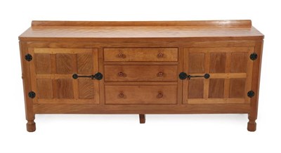 Lot 552 - Mouseman: A Robert Thompson of Kilburn Panelled English Oak 6ft Sideboard, with raised upstand over