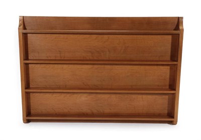 Lot 553 - Mouseman: A Robert Thompson of Kilburn English Oak Open Plate Rack, with four fixed shelves, shaped