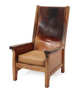 Lot 562 - Mouseman: A Robert Thompson of Kilburn English Oak Smoker's Chair, slung leather back, straight...