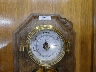 Lot 567 - Mouseman: A Robert Thompson of Kilburn English Oak Barometer/Hygrometer/Thermometer, a brass...