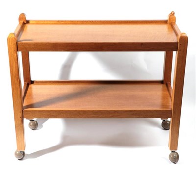 Lot 568 - Mouseman: A Robert Thompson of Kilburn English Oak Tea Trolley/Dinner Wagon, with two tiers...