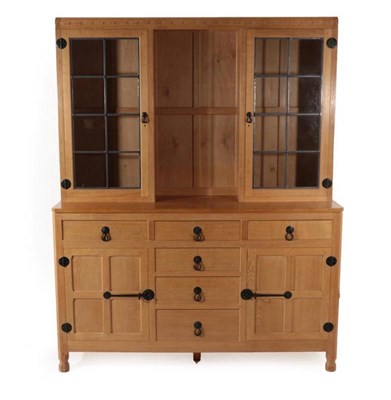Lot 573 - Mouseman: A Robert Thompson of Kilburn English Oak Display Dresser, the top section with...