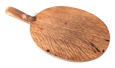 Lot 588 - Mouseman: A Robert Thompson of Kilburn English Oak Cheese Board, with carved mouse signature on...