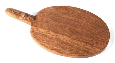 Lot 599 - Mouseman: A Robert Thompson of Kilburn English Oak Cheese Board, with carved mouse signature on...