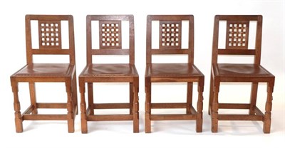 Lot 602 - Mouseman: A Set of Four Robert Thompson of Kilburn English Oak Lattice Back Dining Chairs, with...