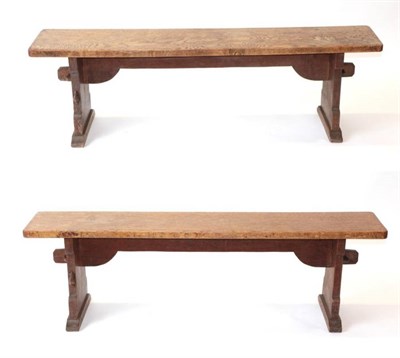 Lot 607 - Mouseman: A Pair of Robert Thompson of Kilburn English Oak Benches, on two shaped supports...