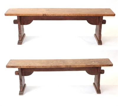 Lot 608 - Mouseman: A Pair of Robert Thompson of Kilburn English Oak Benches, on two shaped supports...