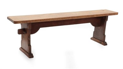 Lot 609 - Mouseman: A Pair of Robert Thompson of Kilburn English Oak Benches, on two shaped supports...