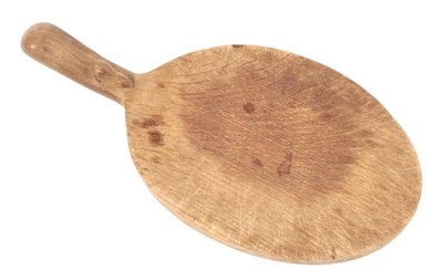 Lot 610 - Mouseman: A Robert Thompson of Kilburn English Oak Cheese Board, with carved mouse signature on...