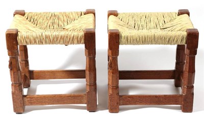 Lot 616 - Mouseman: Two Robert Thompson of Kilburn English Oak Stools, on four octagonal legs joined by...