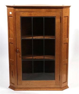 Lot 626 - Lizardman: A Derek Slater of Easingwold English Oak Hanging Corner Cupboard, with leaded glazed...