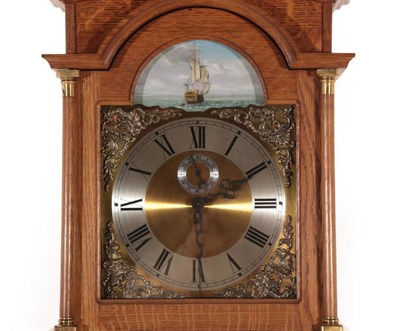 Lot 628 - A Sid Pollard of Thirsk Oak Small Longcase Clock, arched pediment with finials, brass dial with...