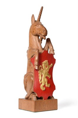 Lot 636 - Woodpeckerman: A Stan Dodds (1928-2012) Carved English Oak Unicorn, in a seated pose with front...