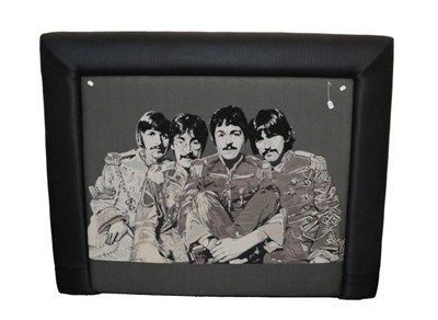 Lot 678 - A Padded Headboard, modern, upholstered in black and grey fabric, decorated with the Beatles, 184cm