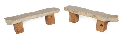 Lot 679 - A Pair of Fossilised Stone Benches, raw edge, polished stone from a quarry near Malton,...