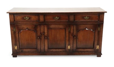 Lot 686 - A Titchmarsh & Goodwin Reproduction Oak Enclosed Dresser, with three long drawers above three...