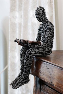 Lot 695 - Richard Stainthorp (Contemporary) ''Reading Man'' Signed and dated 2014, wirework, 45cm high...