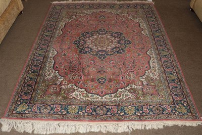 Lot 702 - Kayseri Carpet Central Anatolia The coral pink field with central medallion framed by spandrels and