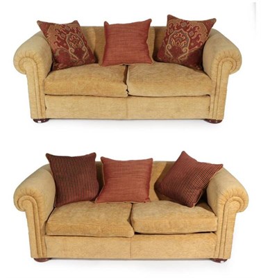 Lot 707 - A Pair of Duresta Maximus Feather-Filled Two-Seater Sofas, circa 2003, covered in light gold...