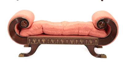 Lot 710 - A Regency Style Mahogany and Parcel Gilt Scroll End Dressing Seat, upholstered in pink watered...