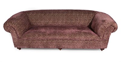 Lot 714 - A Chesterfield Style Sofa, modern, covered in a good quality pink and gold leopard print style...