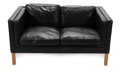 Lot 723 - A 1970's Danish Stouby Two-Seater Sofa, upholstered in black leather, with six cushions, 132cm...