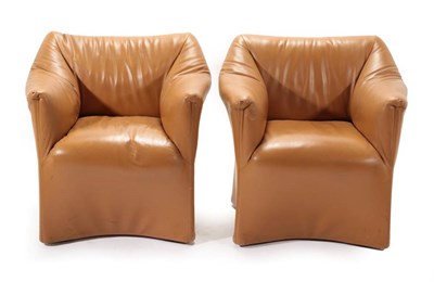 Lot 735 - A Pair of Tan Leather Armchairs in the manner of Mario Bellini, with overstuffed arms and seat,...