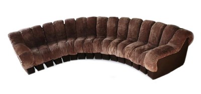 Lot 740 - A 1970's Brown Suede and Felt Segmented Caterpillar Sofa, in the manner of De Sede, in two...